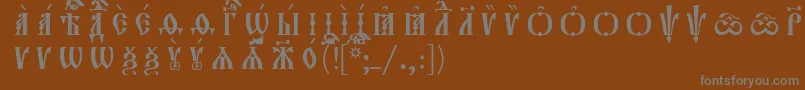 フォントOrthodox.TtIeucs8CapsР Р°Р·СЂСЏРґРѕС‡РЅС‹Р№ – 茶色の背景に灰色の文字